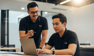 Photo of two Filipino accounting employees in a modern office setup
