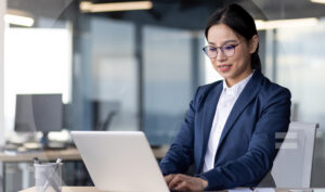 An accountant doing research on her laptop.