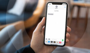 A smartphone displaying a "you're fired" message, representing the dismissal method at the centre of a Fair Work Australia case