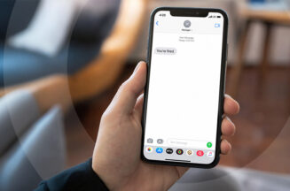 A smartphone displaying a "you're fired" message, representing the dismissal method at the centre of a Fair Work Australia case